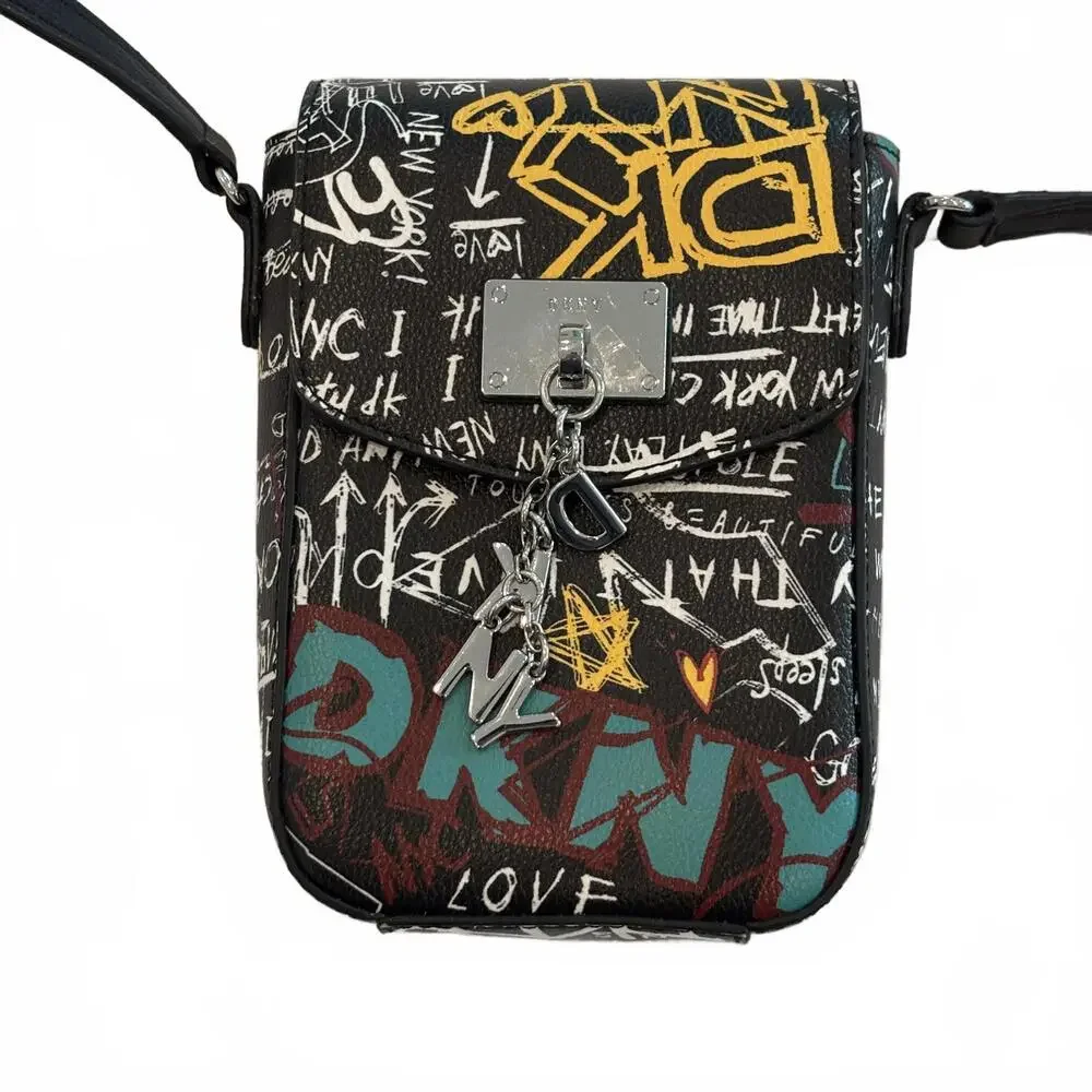 DKNY Cleo Graffiti North South Phone Crossbody Bag in black‎ faux leather.